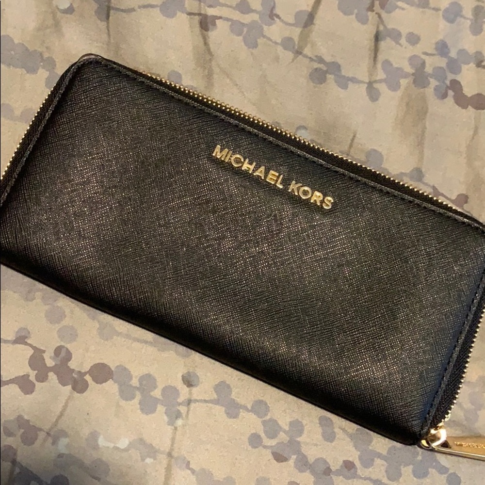 Large black Michael Kors wallet with gold trim